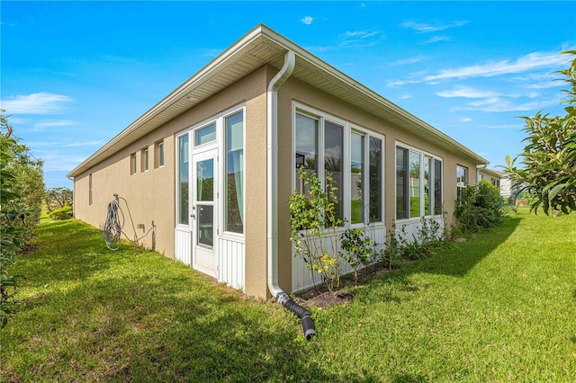 view of home's exterior featuring a lawn