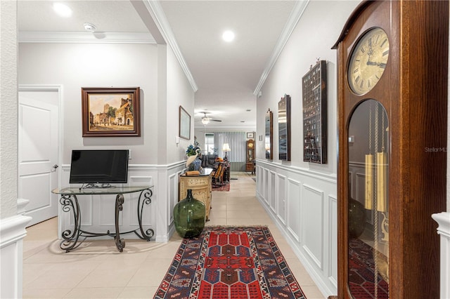 hall featuring light tile patterned flooring and ornamental molding