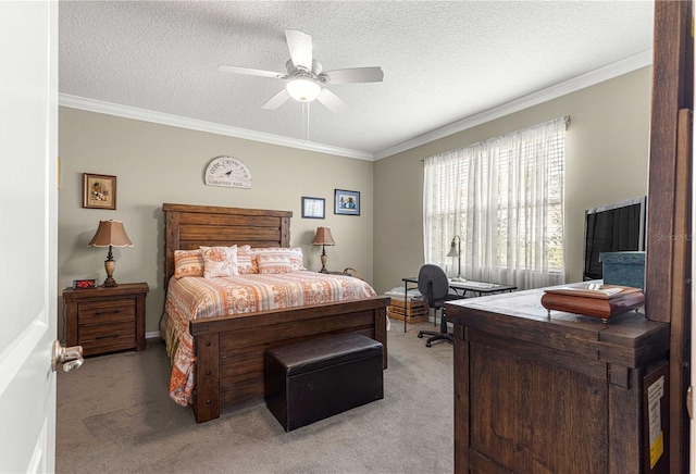 carpeted bedroom featuring a textured ceiling, ceiling fan, and crown molding