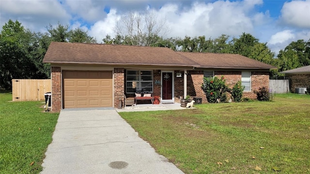 single story home featuring a front yard, cooling unit, and a garage