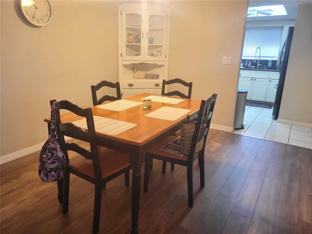 dining room featuring sink and hardwood / wood-style flooring