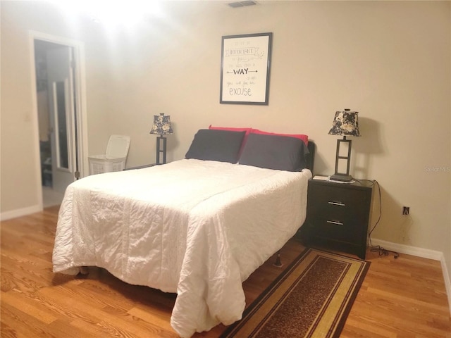 bedroom featuring light hardwood / wood-style floors