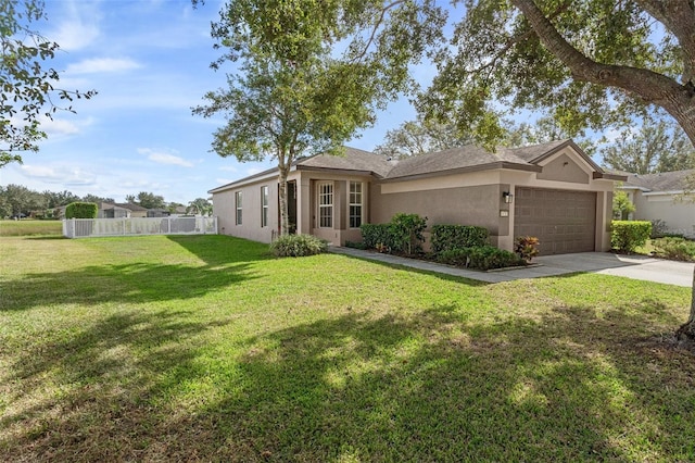 view of front facade featuring a garage and a front lawn