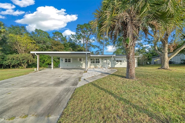 single story home with a front yard and a carport