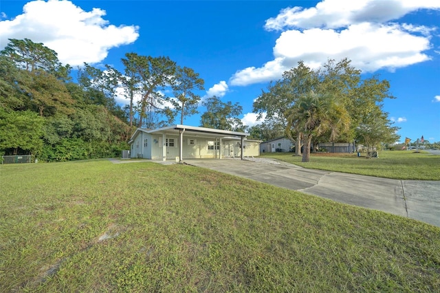 view of front of property with a front yard and a carport