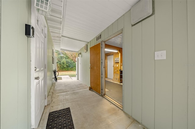 view of patio featuring a wall mounted air conditioner