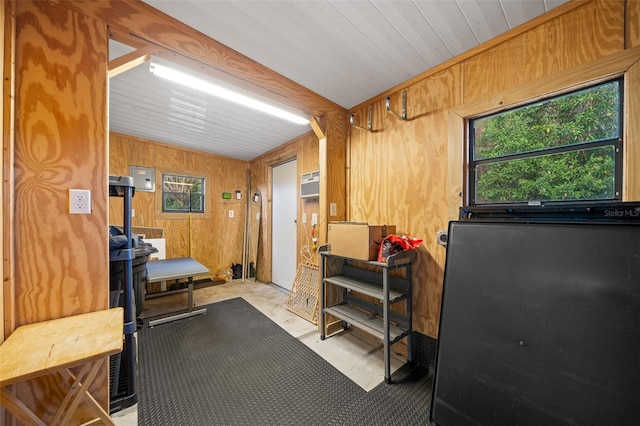 miscellaneous room with wood walls