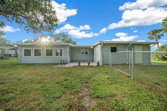 back of house with a yard