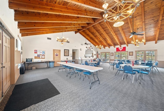 carpeted dining space featuring beam ceiling, high vaulted ceiling, wood ceiling, and ceiling fan with notable chandelier