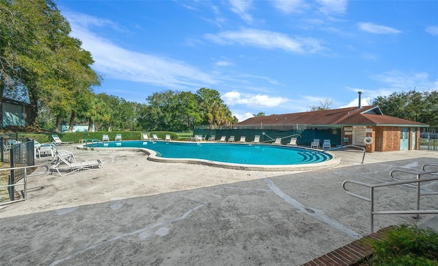 view of swimming pool with a patio area