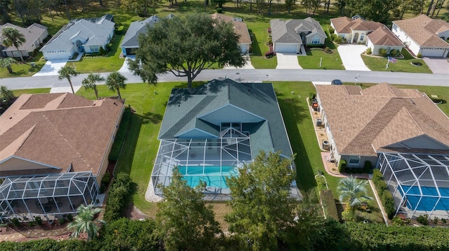 birds eye view of property with a residential view