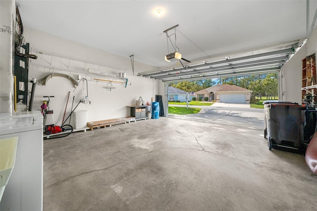 garage featuring separate washer and dryer and a garage door opener