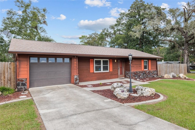 single story home with a garage and a front yard