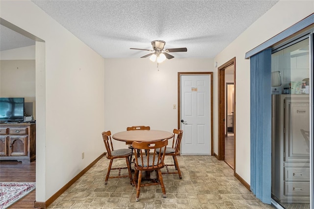 dining space with light wood-type flooring, a textured ceiling, and ceiling fan