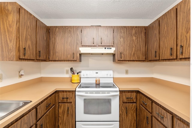 kitchen with a textured ceiling, sink, and white range with electric stovetop