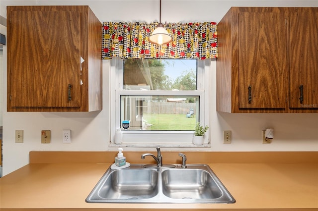 kitchen with hanging light fixtures and sink