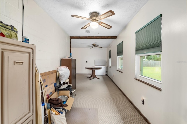 interior space with lofted ceiling and a textured ceiling