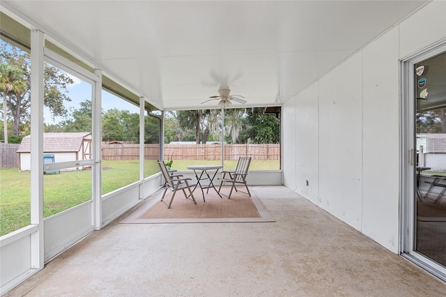 sunroom / solarium featuring ceiling fan and plenty of natural light