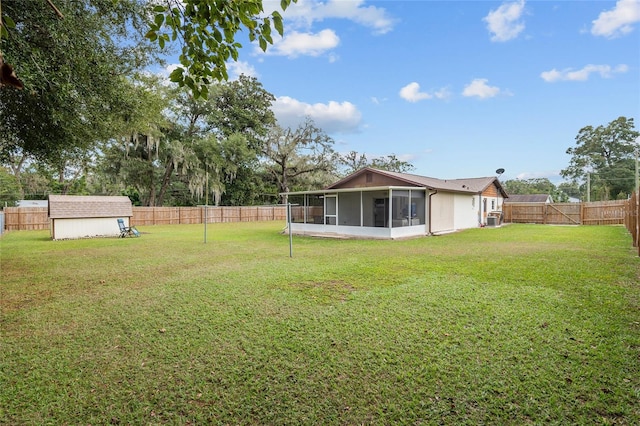 view of yard with a storage shed and a sunroom