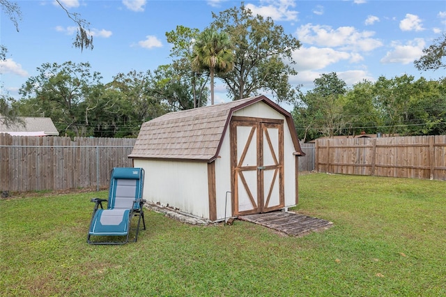 view of outbuilding with a lawn