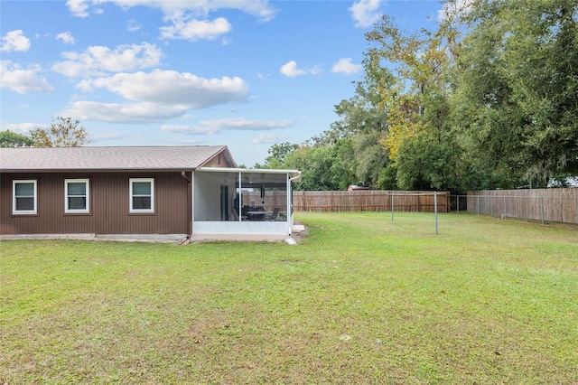 view of yard featuring a sunroom