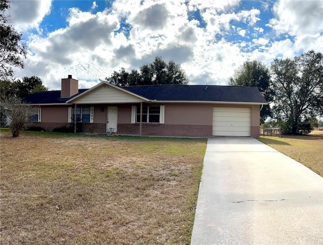 ranch-style house with a garage and a front lawn