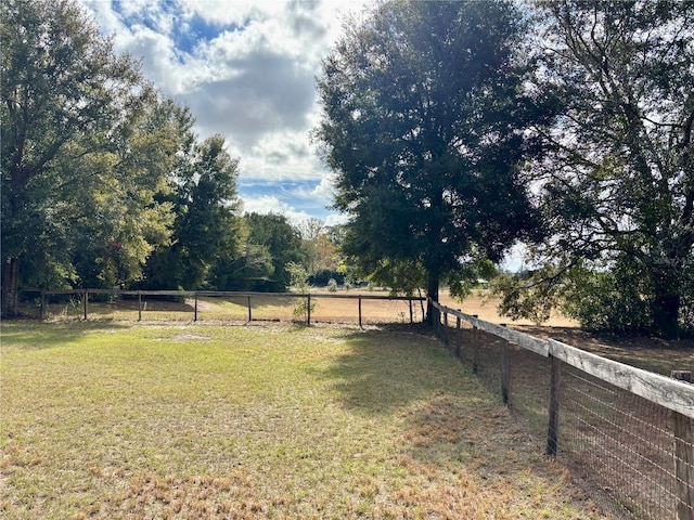 view of yard with a rural view