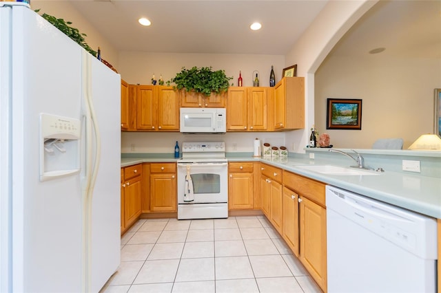 kitchen featuring kitchen peninsula, white appliances, sink, and light tile patterned flooring