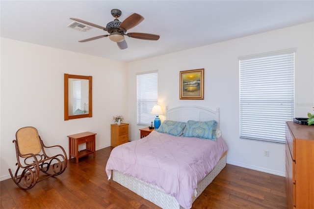 bedroom featuring dark hardwood / wood-style floors and ceiling fan