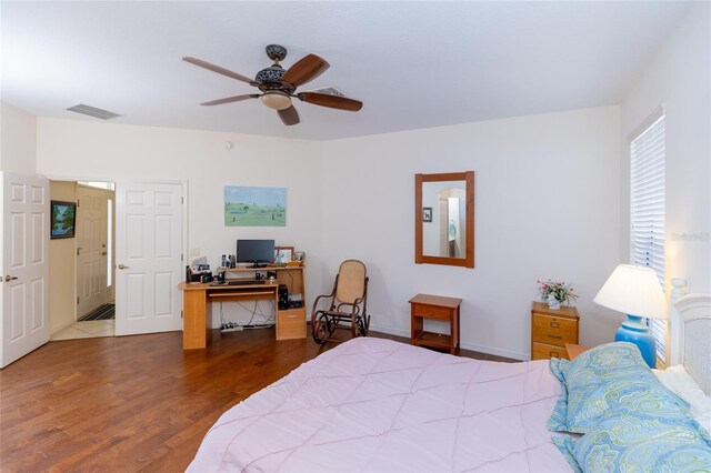 bedroom featuring dark hardwood / wood-style flooring and ceiling fan