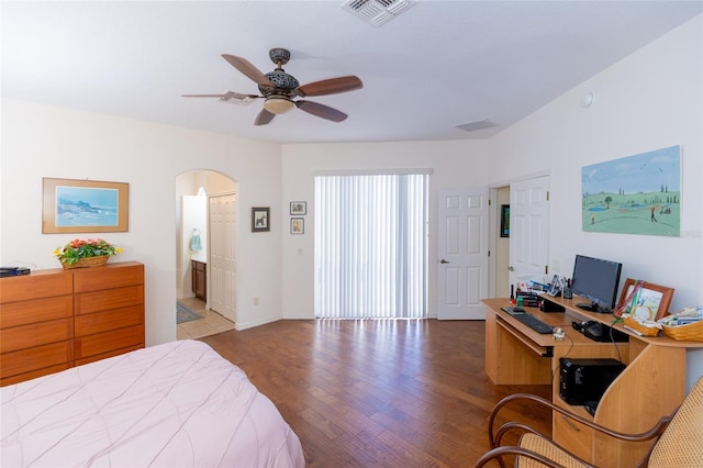 bedroom with hardwood / wood-style flooring, ceiling fan, and ensuite bathroom