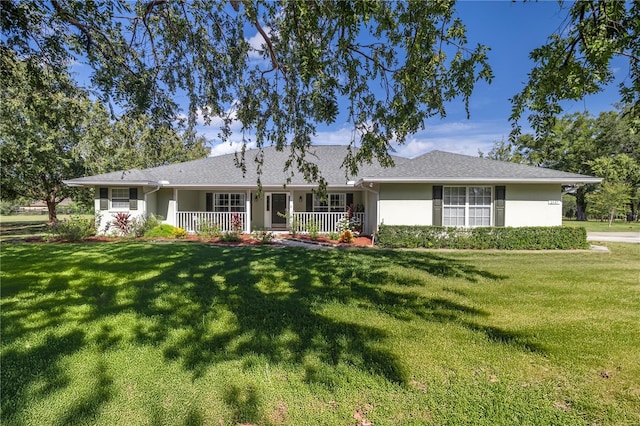 view of front of property with a front lawn and covered porch