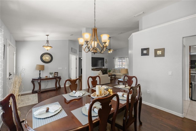 dining room featuring dark hardwood / wood-style floors and ceiling fan with notable chandelier