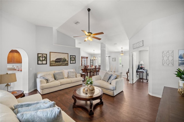 living room featuring ceiling fan with notable chandelier, high vaulted ceiling, and dark hardwood / wood-style flooring