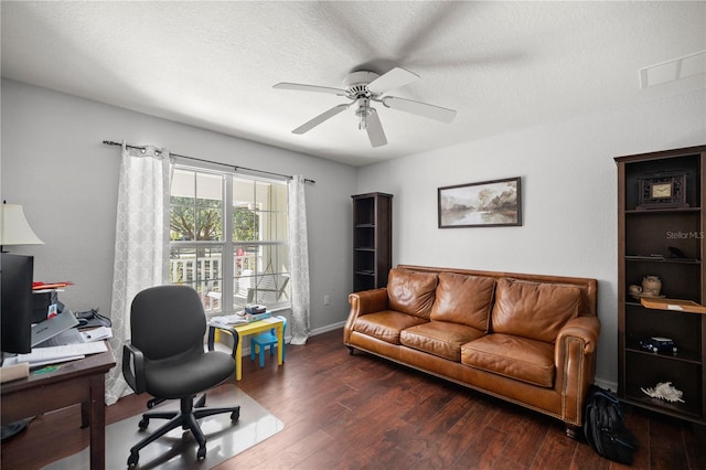 office featuring a textured ceiling, dark wood-type flooring, and ceiling fan