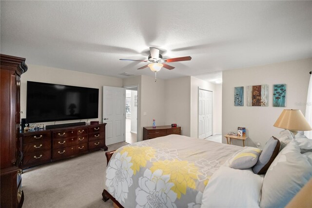5537 SW 38th St, Ocala, FL 34474 - carpeted bedroom with a closet, a ceiling fan, and a textured ceiling