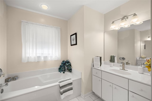 bathroom featuring vanity, a bath, and tile patterned floors