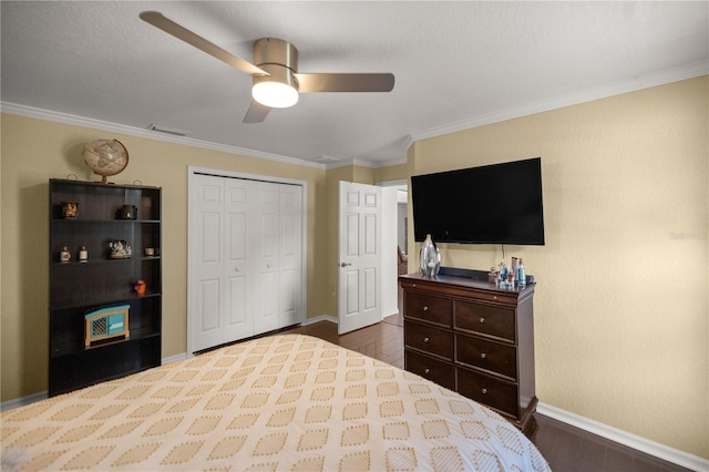 5537 SW 38th St, Ocala, FL 34474 - bedroom with baseboards, dark wood-type flooring, crown molding, ceiling fan, and a closet
