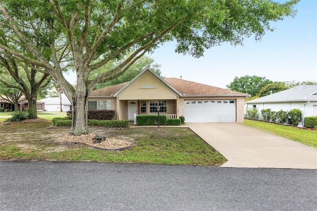 single story home featuring a porch and a garage