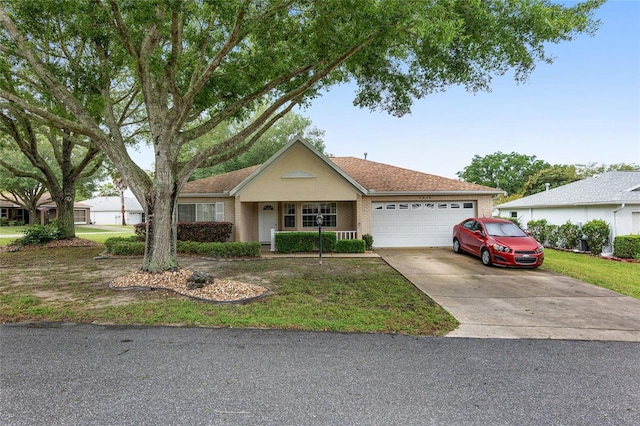 ranch-style home featuring a porch, a garage, and a front lawn