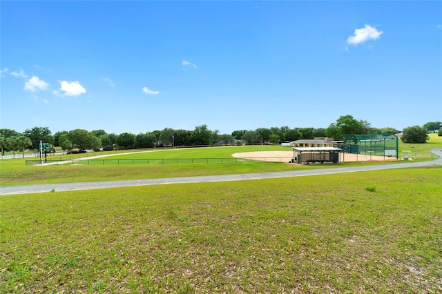 view of property's community with a lawn