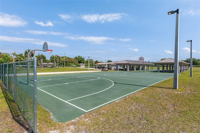 view of basketball court with a gazebo and a lawn