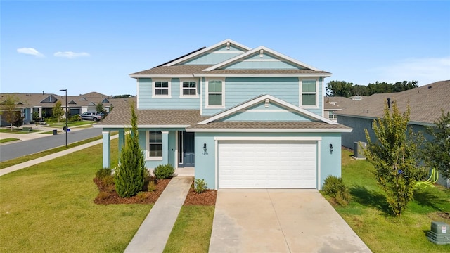 view of front of property featuring a garage and a front yard