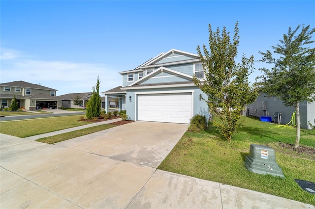 view of front facade with a front yard and a garage