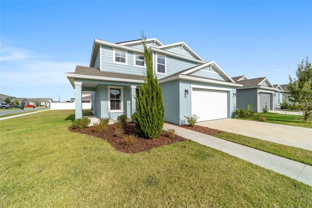 view of front of house with a garage and a front lawn