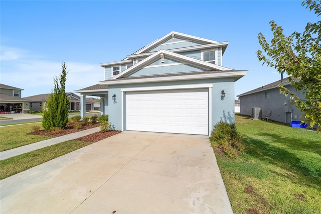 view of front of property with a garage and a front yard