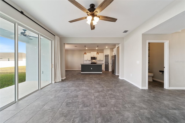 unfurnished living room featuring ceiling fan