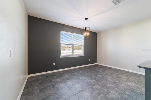 unfurnished dining area with a chandelier