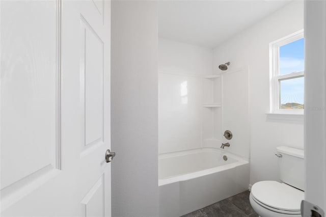 bathroom featuring toilet and shower / washtub combination