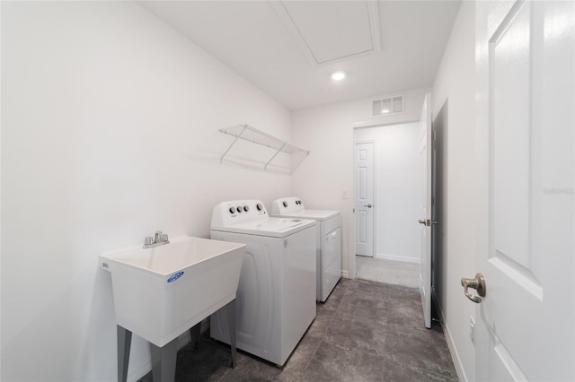 laundry area featuring sink and washing machine and clothes dryer